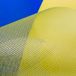 Intriguing abstract art with yellow and blue mesh against a vibrant background, ideal for modern design.