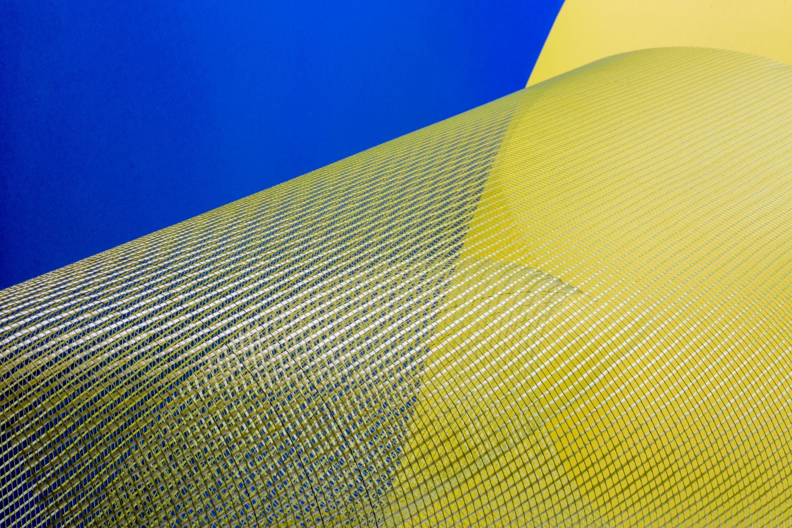 Intriguing abstract art with yellow and blue mesh against a vibrant background, ideal for modern design.