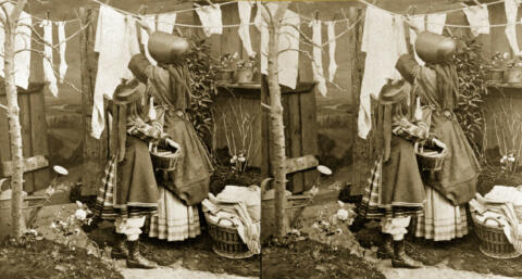 the Young Housekeeper hanging Clothes